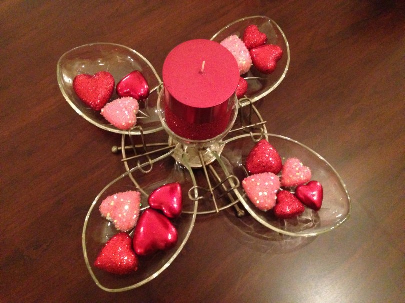 This is an old retro server that I turned into a centerpiece for my coffee table.  I bought the hearts and candle at Pier 1 Imports.  I thought outside the box and bought the candle at 75% off because they were in the Christmas clearance section.  The candle ended up being about $2.50.  